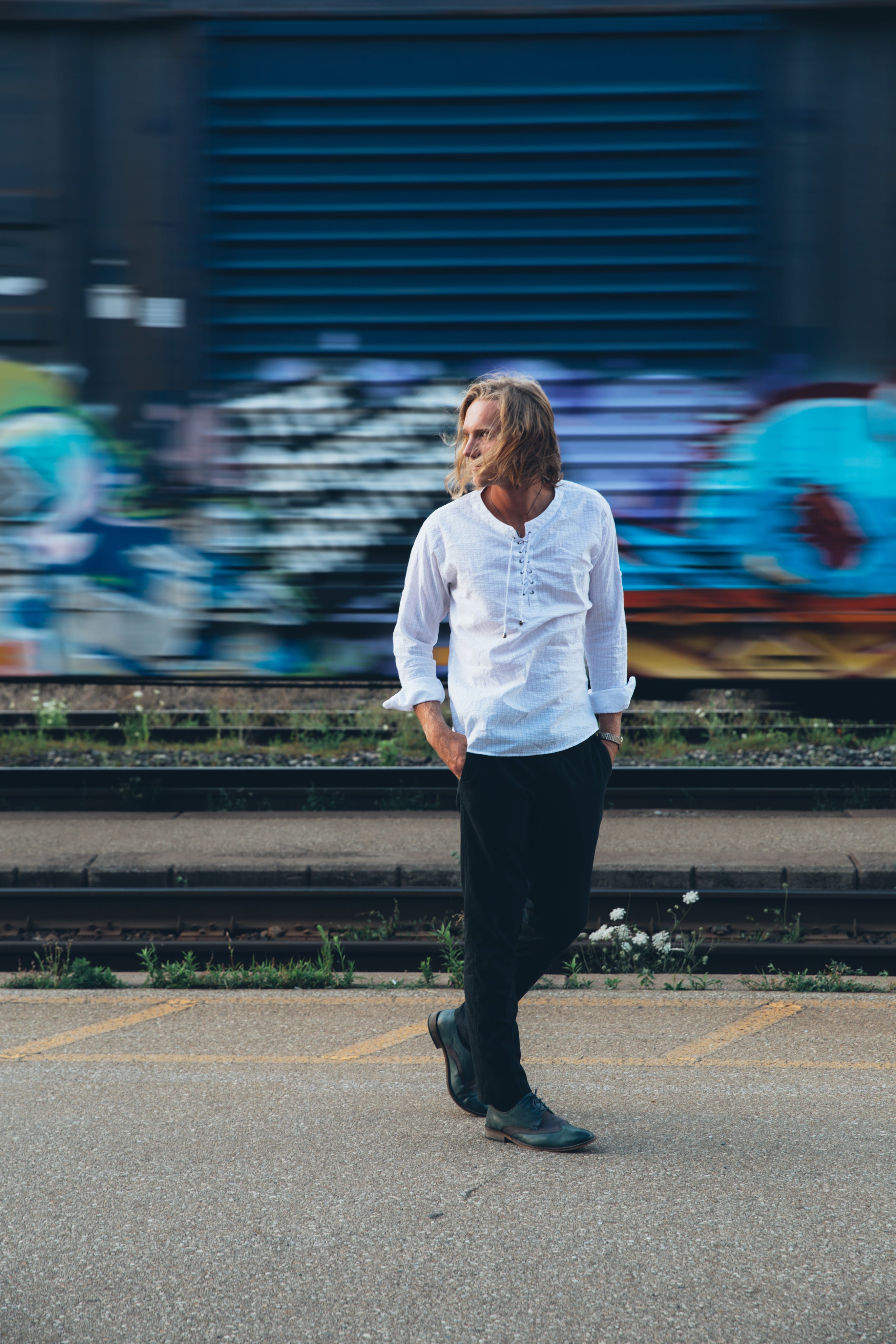 files/fashionable-man-walks-by-train-tracks.jpg